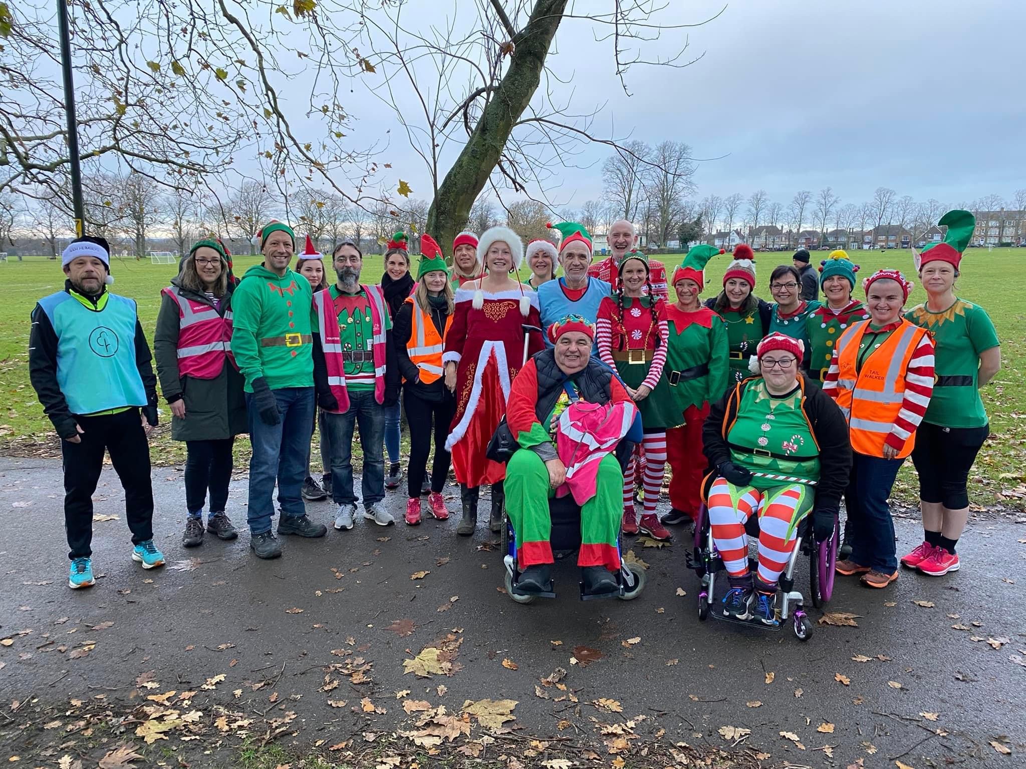 Michelle's final parkrun group photograph of Step Forward With Lewis runners and wheelchair users